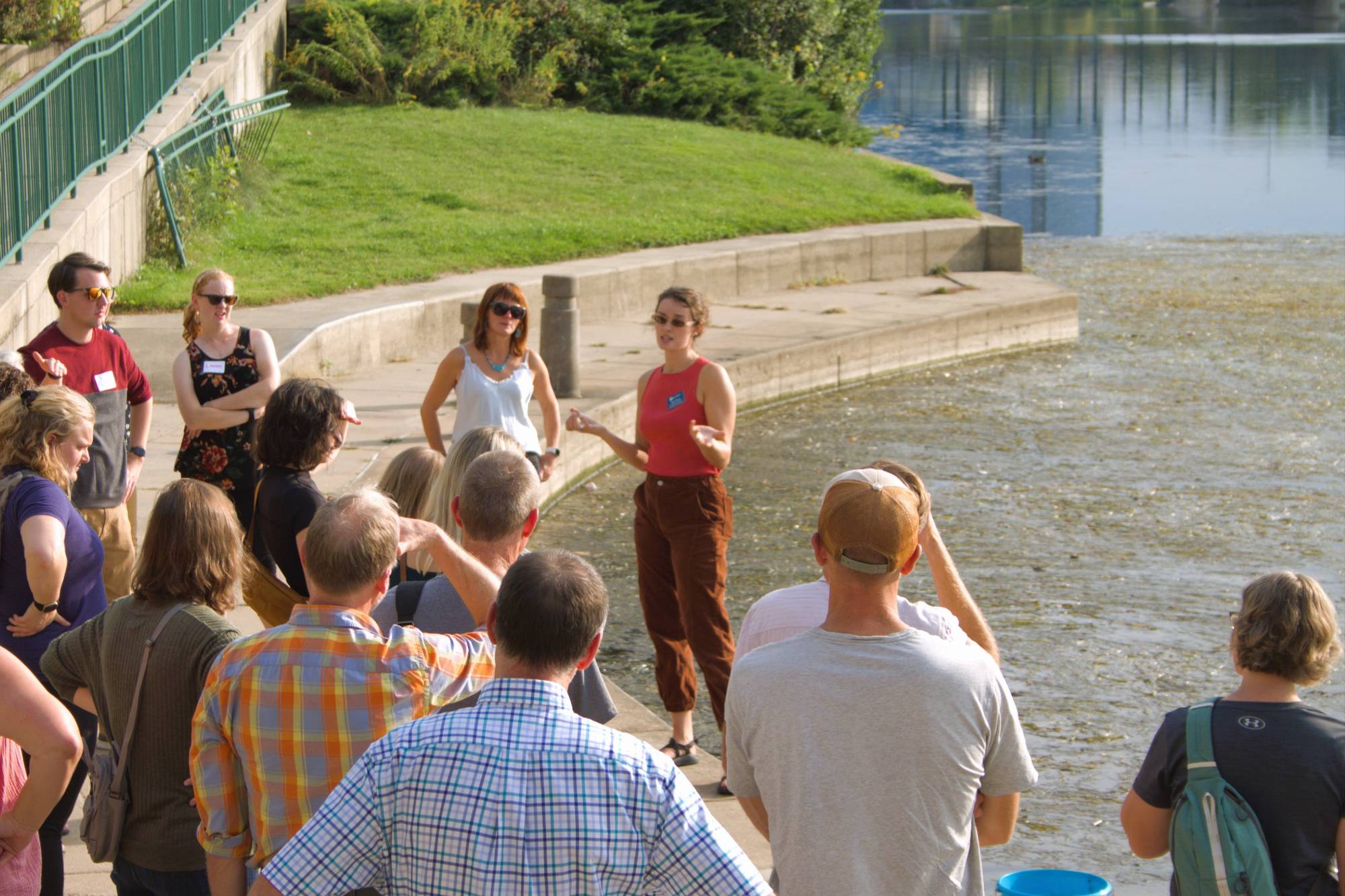 Groundswell staff addressing group of teachers by a river